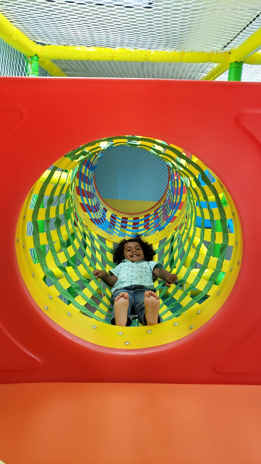 Child on tunnel slide